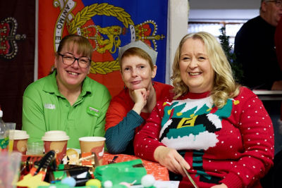 Community champion Catharine throws surprise party for Trafford Veterans